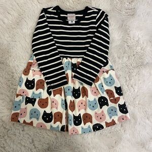 Hanna Andersson Play pocket dress with cat design.